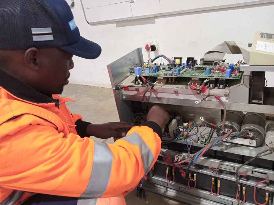 Technician repairing a UPS Unit